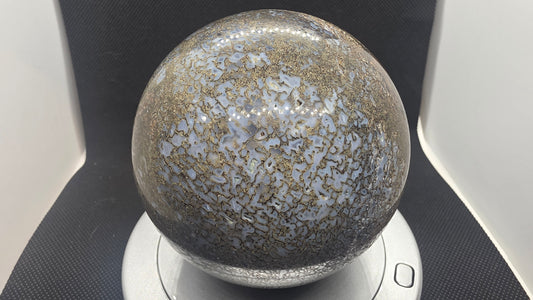 Agatized dinosaur bone sphere