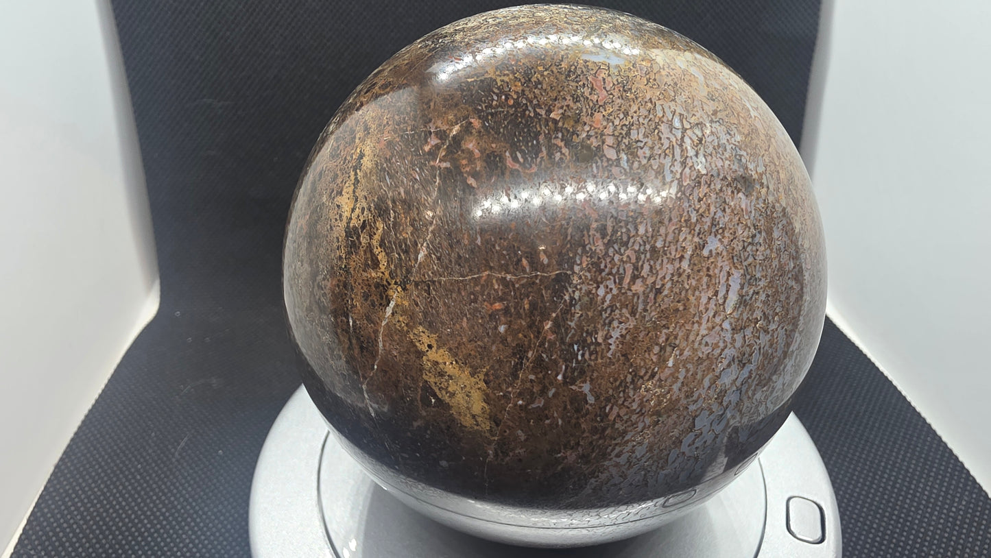 Agatized dinosaur bone sphere