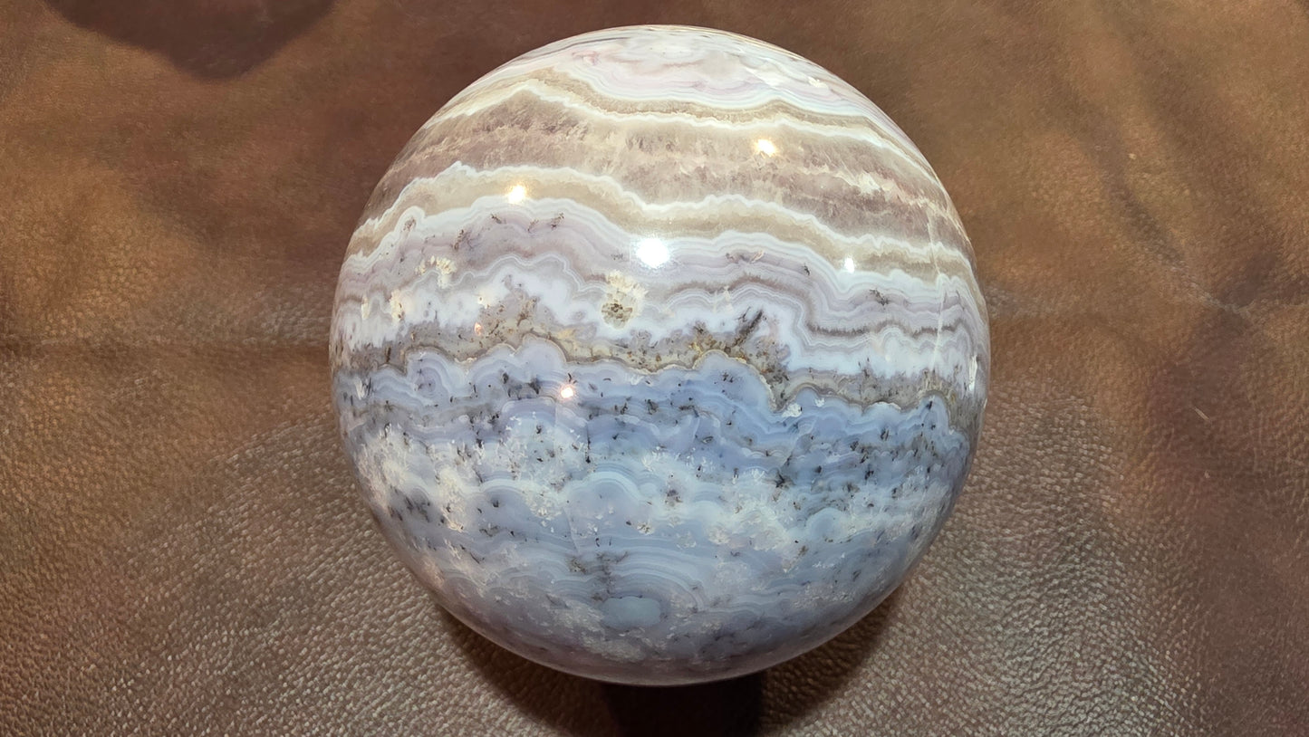 Sowbelly agate and amethyst sphere