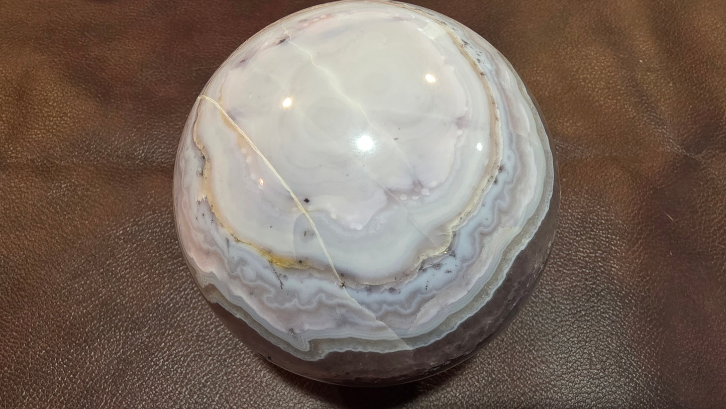 Sowbelly agate and amethyst sphere