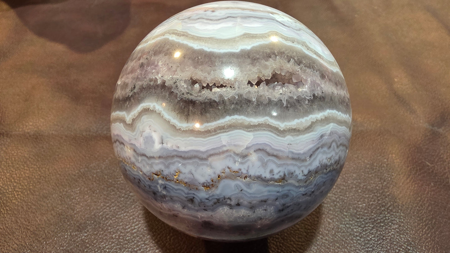 Sowbelly agate and amethyst sphere