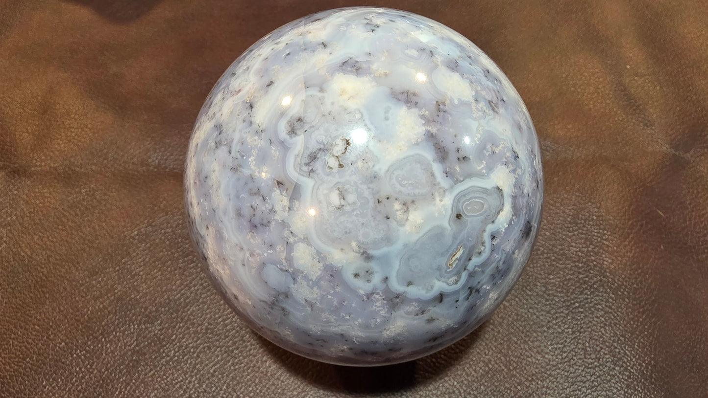 Sowbelly agate and amethyst sphere